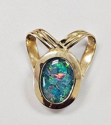 A 14K Yellow Gold and Opal Mosaic Slide Pendant. A 14K yellow gold pendant featuring a central 