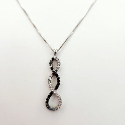 10K Gold Diamond Pendant Necklace 4 Grams. A 10-karat white gold necklace featuring a pendant 