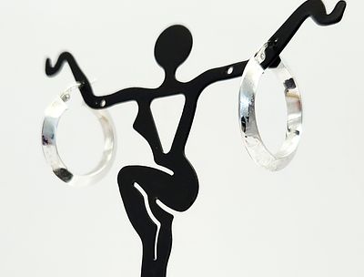 14KT Gold Hoop Earrings 3.4 Grams. A pair of 14kt white gold hoop earrings featuring a modern 