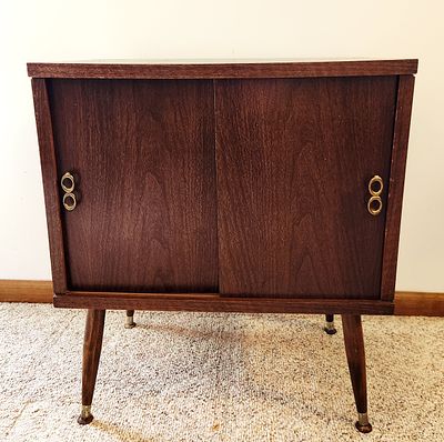 A Mid-Century Modern Lu Van Inc. Record Storage Cabinet. A mid-century modern record storage 