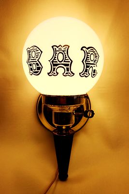 Vintage Brass-Toned Wall-Mounted BAR Sconce. This wall-mounted light fixture features a 