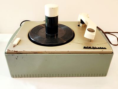 RCA Victor Victrola Model 6-JY-1C tabletop record player. The record player is a mid-century 