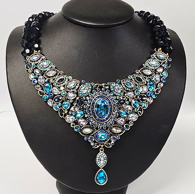 Heidi Daus Blue Crystal Bib Statement Necklace. This bib-style statement necklace is produced by 