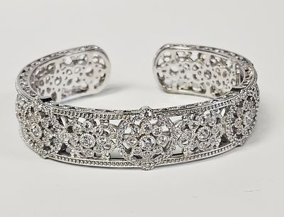 Judith Ripka Sterling Cubic Zirconia Bracelet 43.9 Grams. A sterling silver hinged cuff bracelet 