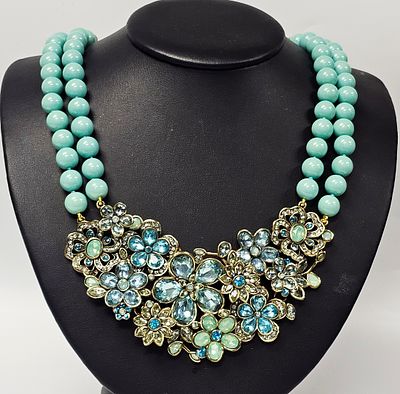 Heidi Daus Floral Crystal Bib Necklace with Turquoise Beads. A Heidi Daus bib necklace featuring 
