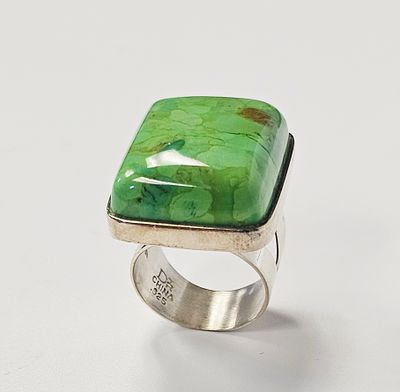 Jay King Sterling Green Turquoise Ring 18.6 Grams. A sterling silver cocktail ring featuring a 