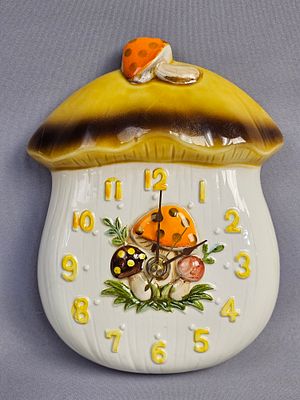 Merry Mushroom Ceramic Wall Clock. This wall clock features the Sears Roebuck and Co. Merry 