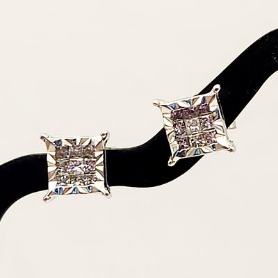 10K White Gold Earrings 1.3 Grams. This pair of stud earrings is crafted in 10 karat white gold. 