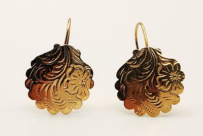 14K Gold Earrings 1.1 Grams. This pair of 14 karat yellow gold earrings features circular drops 