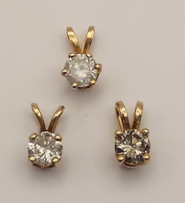 14K Solitaire Pendants 1.4 Grams. This trio of solitaire slider pendants is crafted from 14 