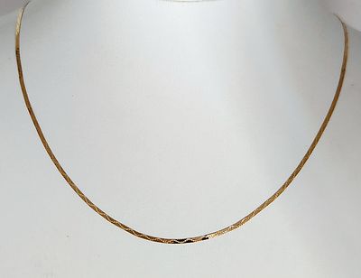 14K Gold Herringbone Necklace 1.3 Grams. This flat herringbone link necklace chain is crafted in 