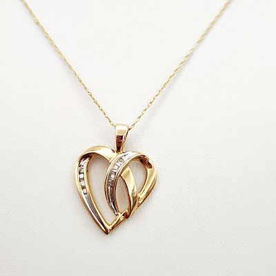 10K Heart Necklace 2.7 Grams. This necklace features a stylized double heart pendant in 10 karat 