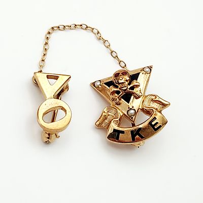 Tau Kappa Epsilon Fraternity Pin 3. A Tau Kappa Epsilon (TKE) fraternity membership badge and 