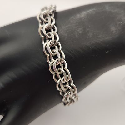 Elco Sterling Triple Link Bracelet 23 Grams. This vintage sterling silver bracelet features a 