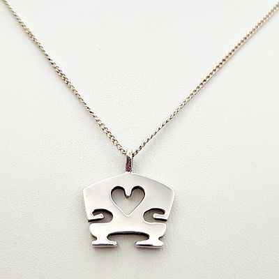 Sterling Stylized Necklace 6.1 Grams. This sterling silver necklace features a stylized pendant. 