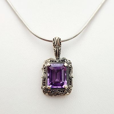 Sterling Amethyst Necklace 7.7 Grams. This sterling silver necklace features a rectangular 