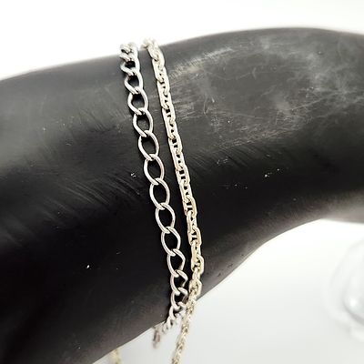 Two Sterling Bracelets. This lot features two sterling silver chain bracelets of Italian 