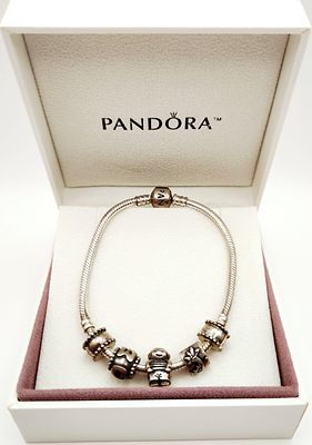 Pandora Sterling Charm Bracelet 29.8 Grams. A Pandora sterling silver snake chain charm bracelet 