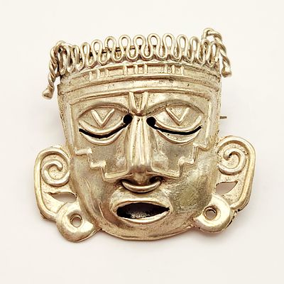 Sterling Mask Brooch 6 Grams. A vintage Mexican sterling silver repousse brooch depicting a 