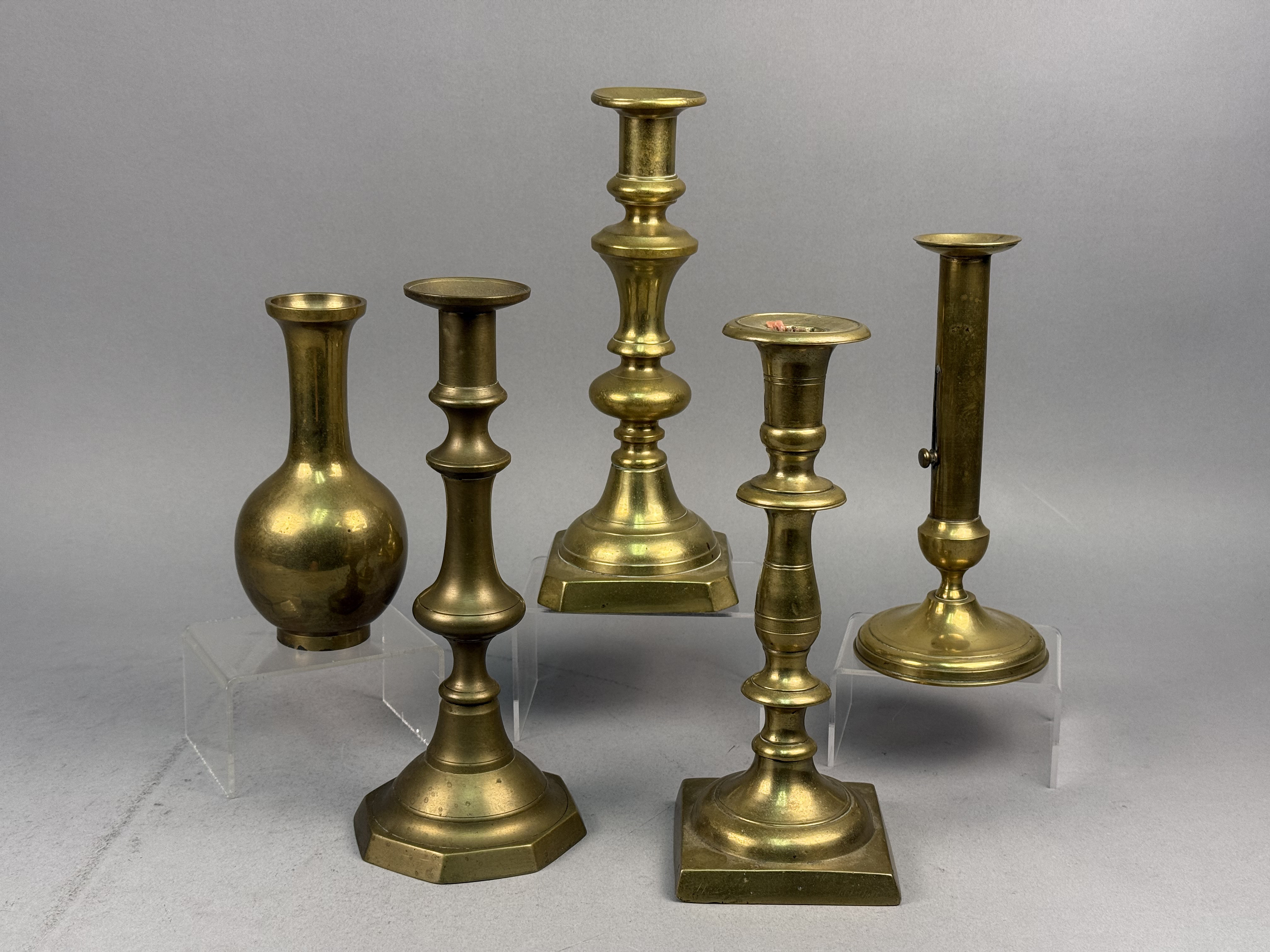 Assorted Brass Candlesticks and a Bud Vase