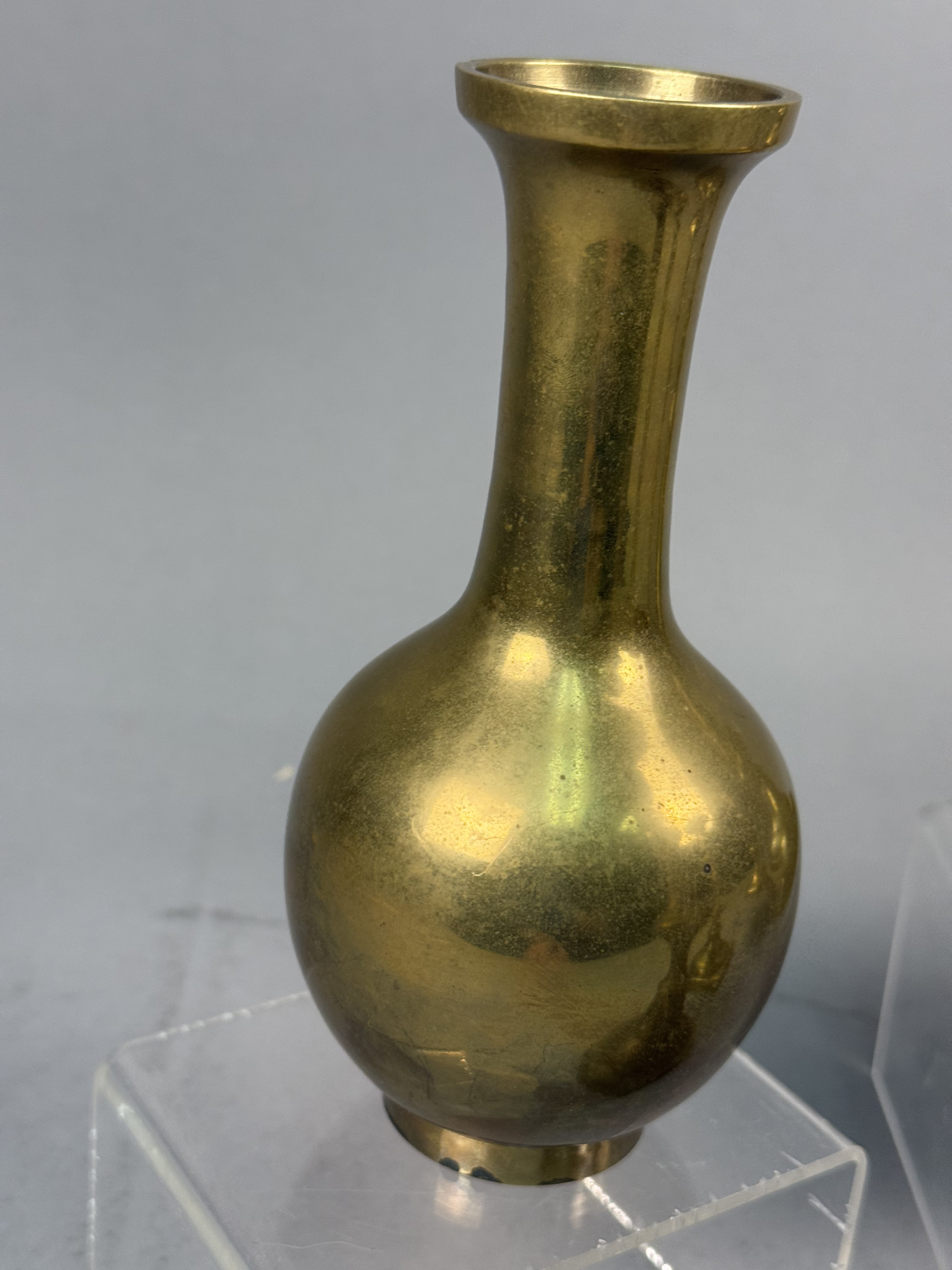 Assorted Brass Candlesticks and a Bud Vase