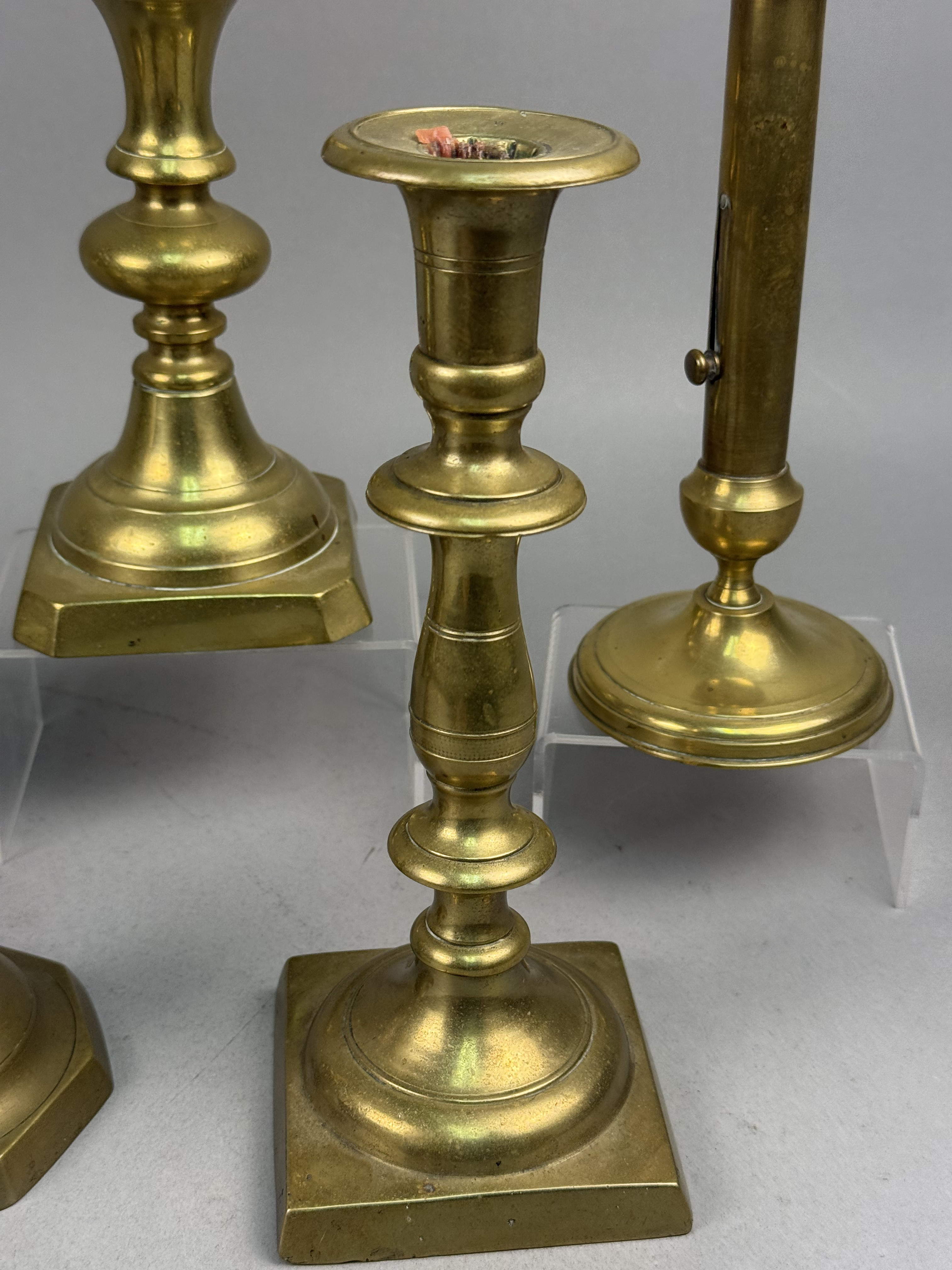 Assorted Brass Candlesticks and a Bud Vase