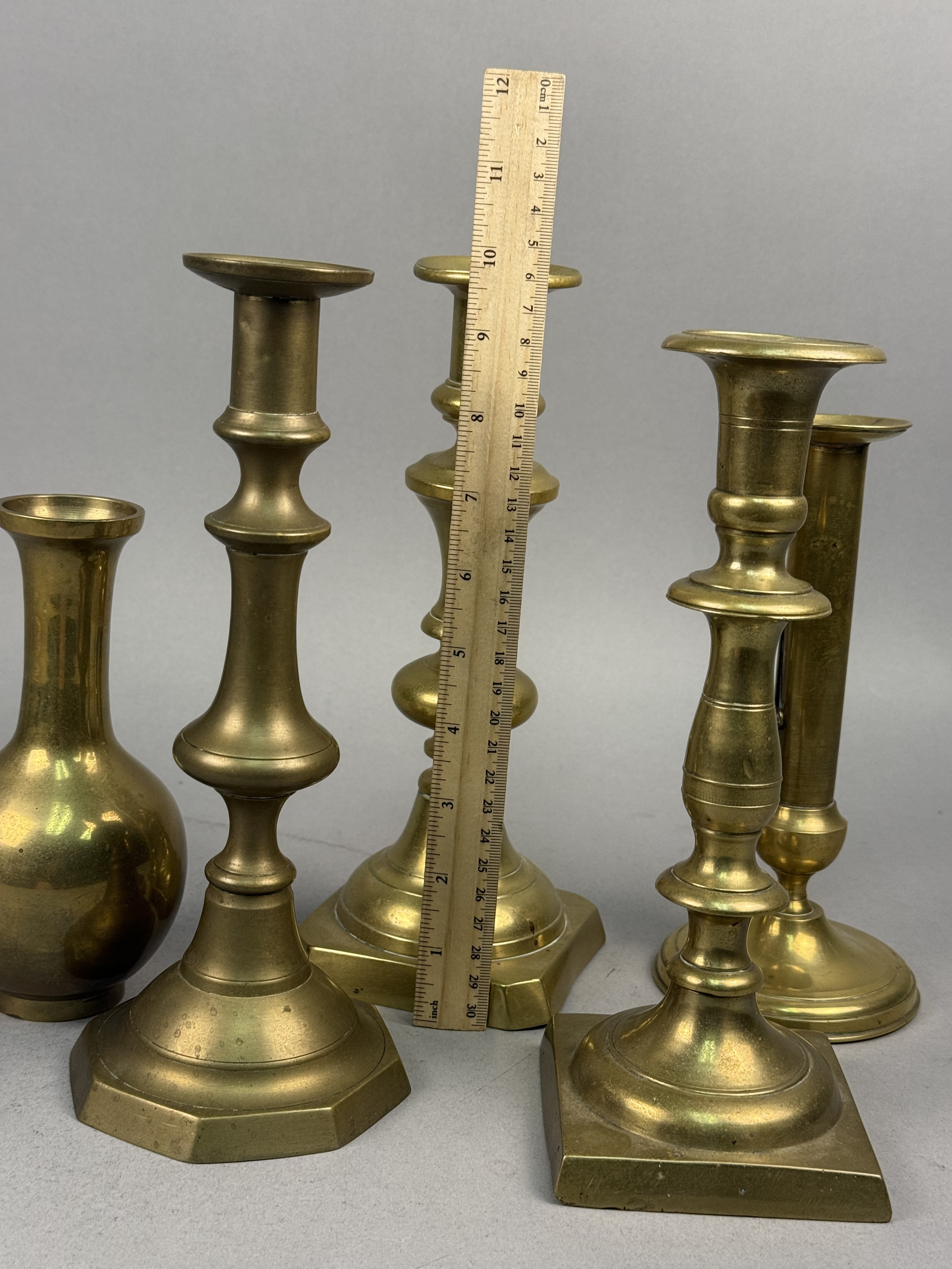 Assorted Brass Candlesticks and a Bud Vase