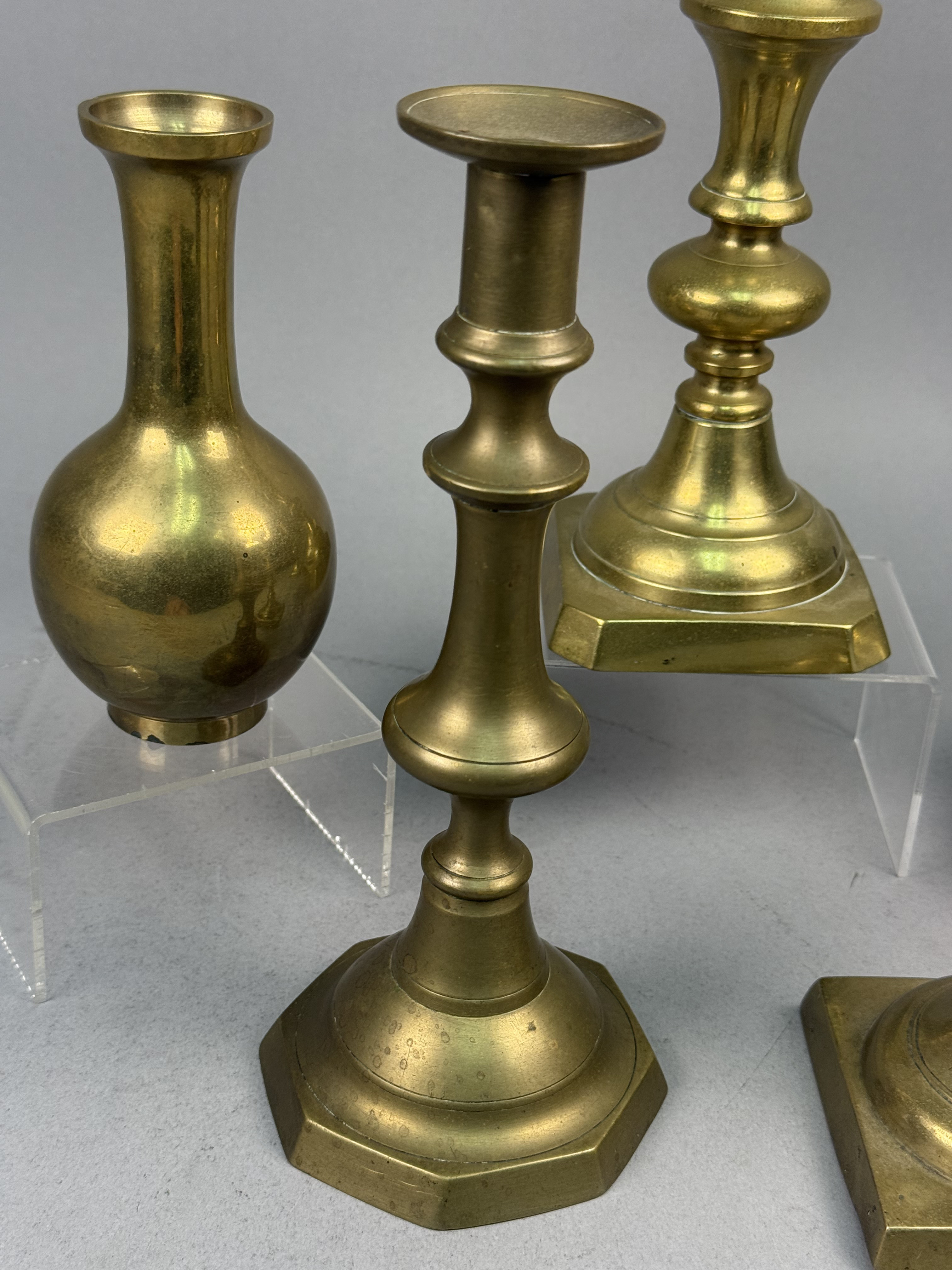 Assorted Brass Candlesticks and a Bud Vase