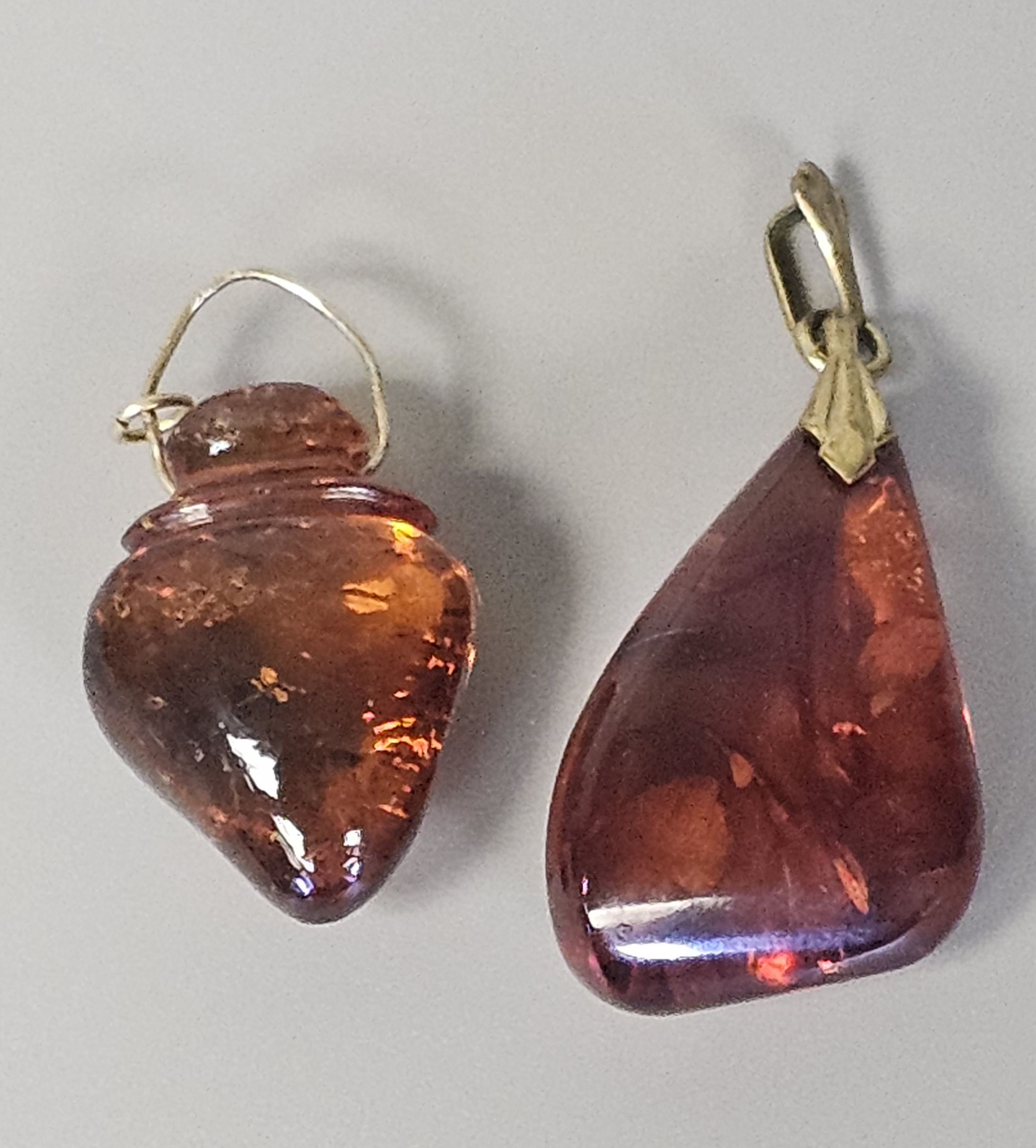 Two Translucent Cognac Amber Pendants