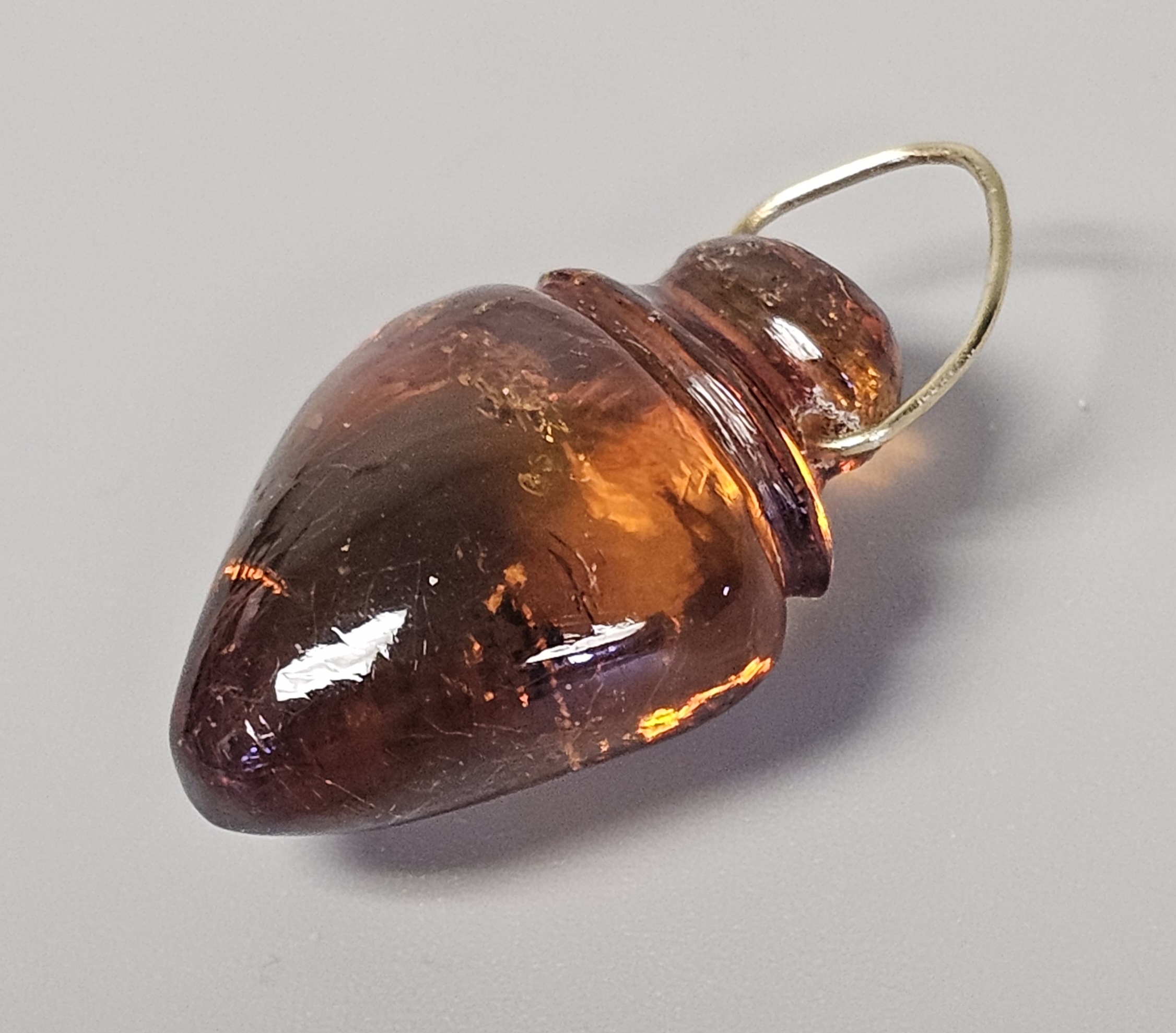 Two Translucent Cognac Amber Pendants
