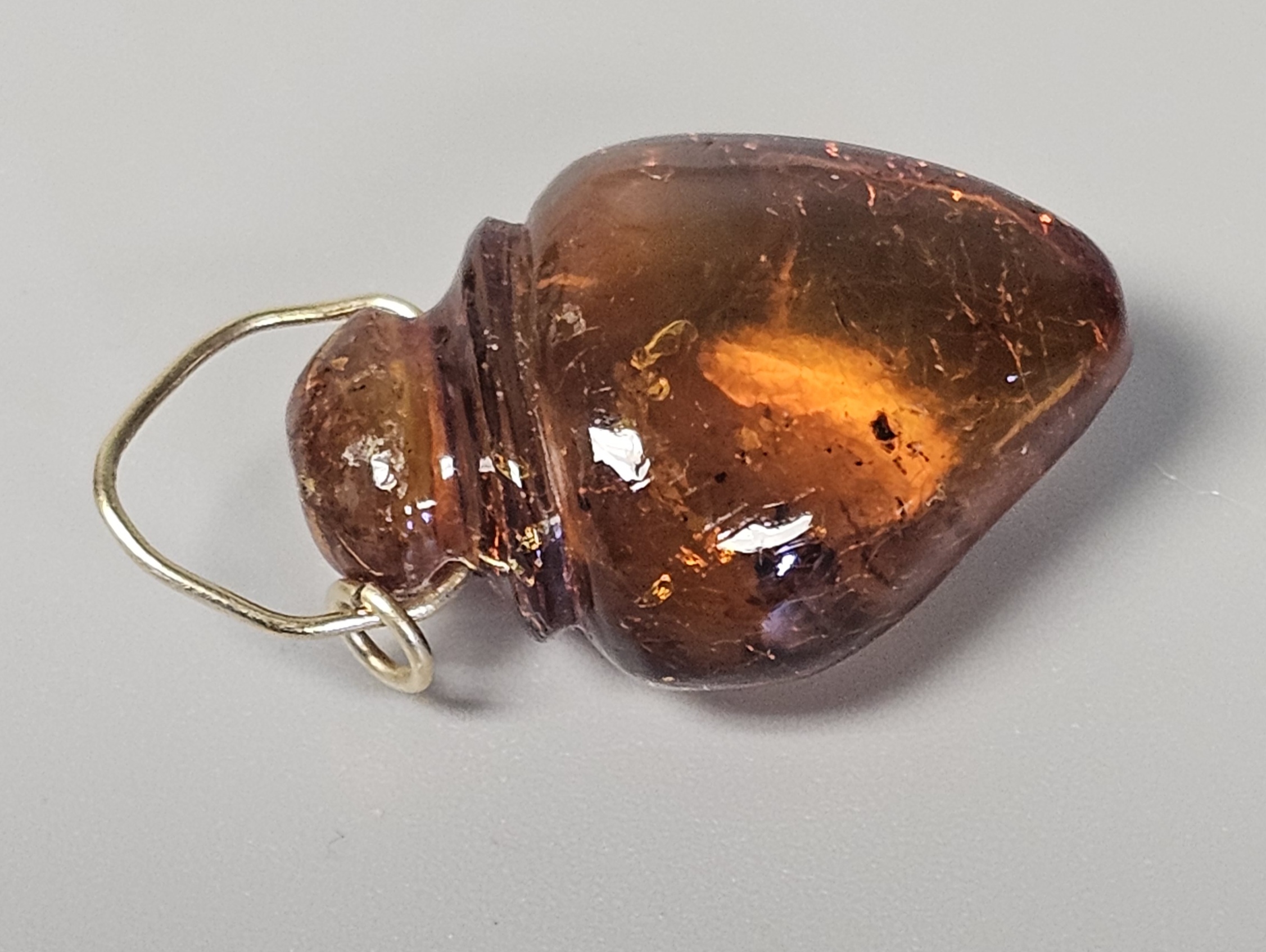 Two Translucent Cognac Amber Pendants