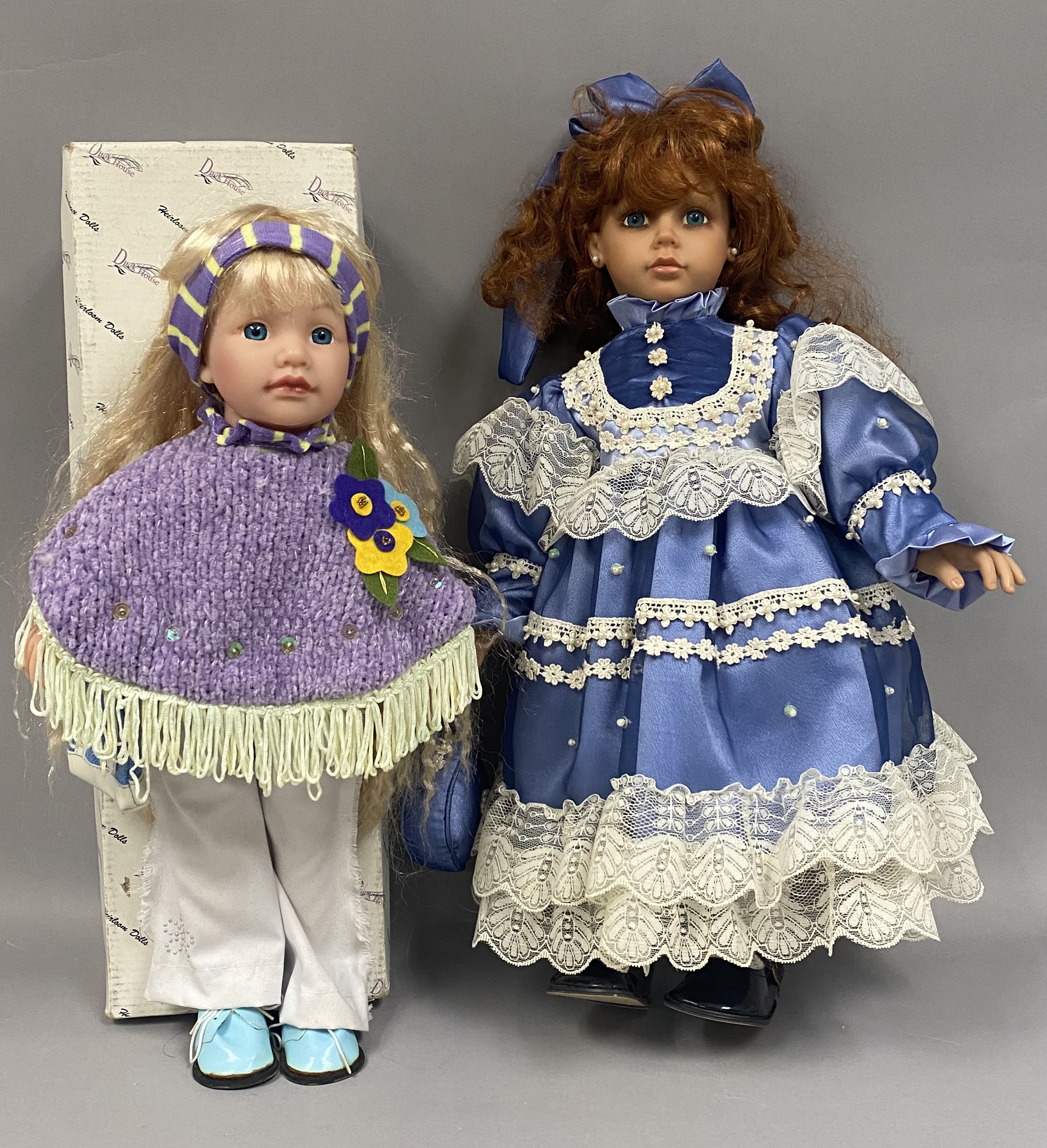 Two Collectible Vinyl Dolls