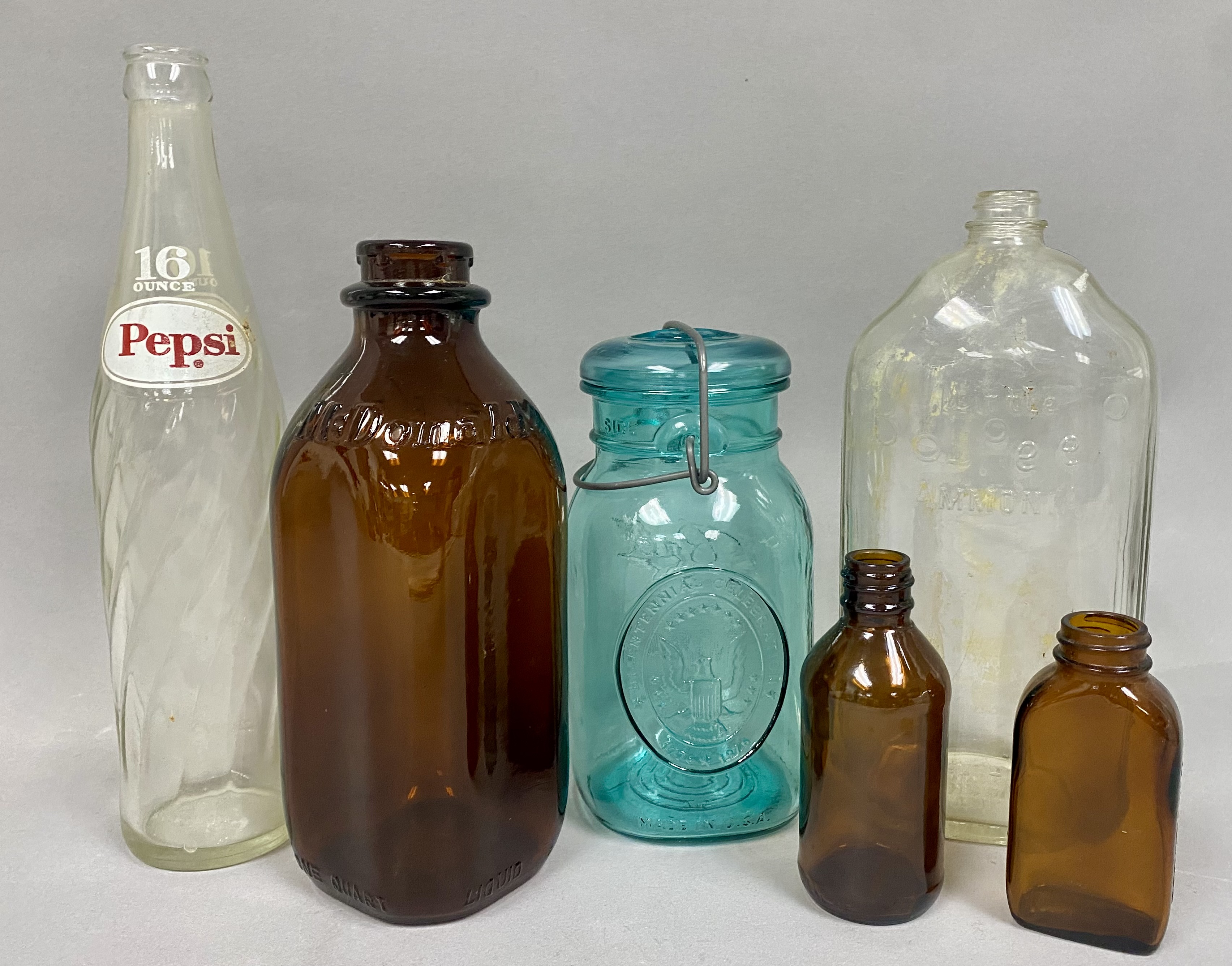Six Vintage American Glass Bottles and Jars