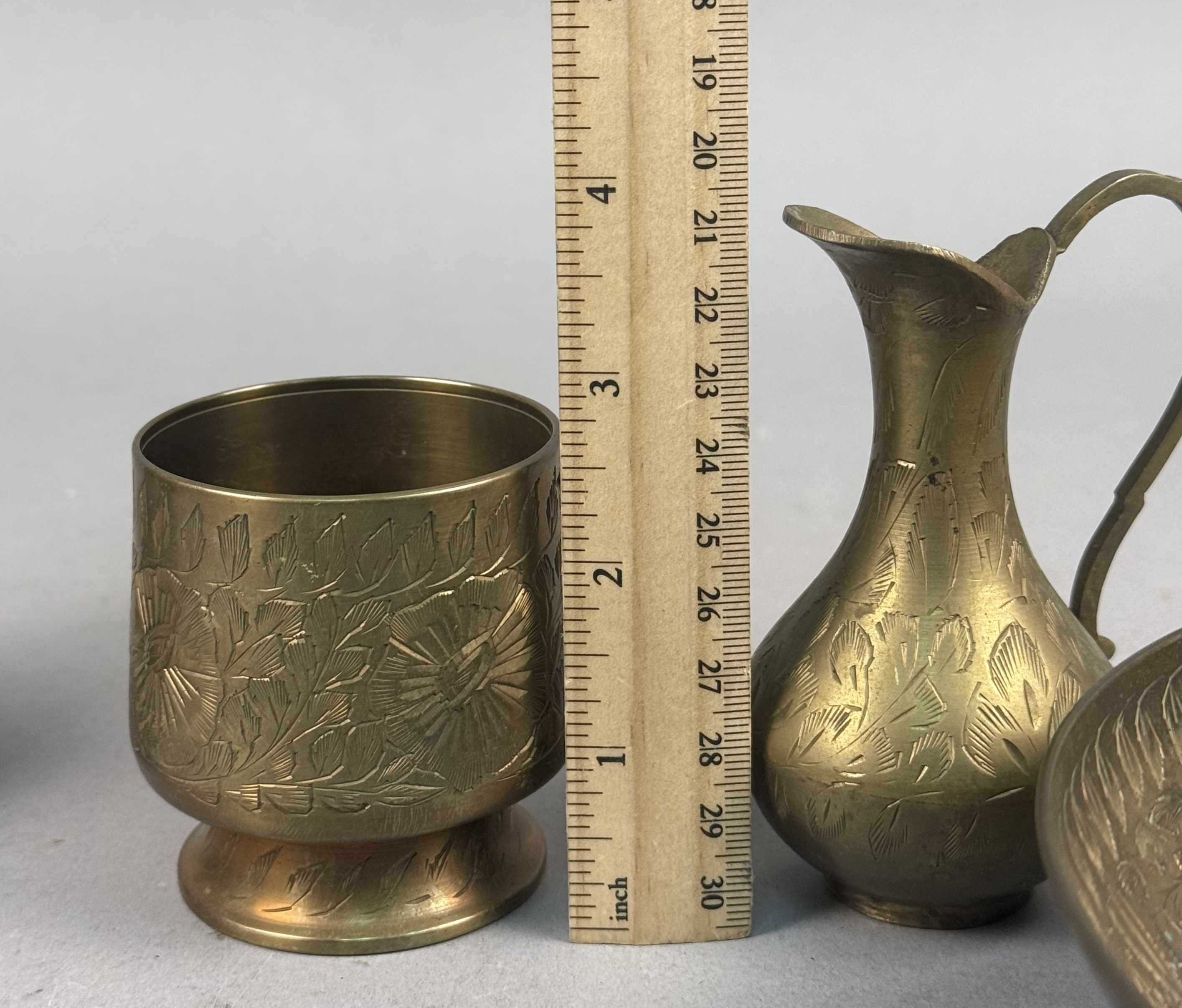 Four Indian Etched Brass Vessels