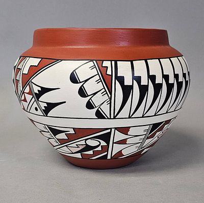 Jemez Pueblo Polychrome Pottery Jar. A handmade Jemez Pueblo earthenware jar signed by E. Tafoya 