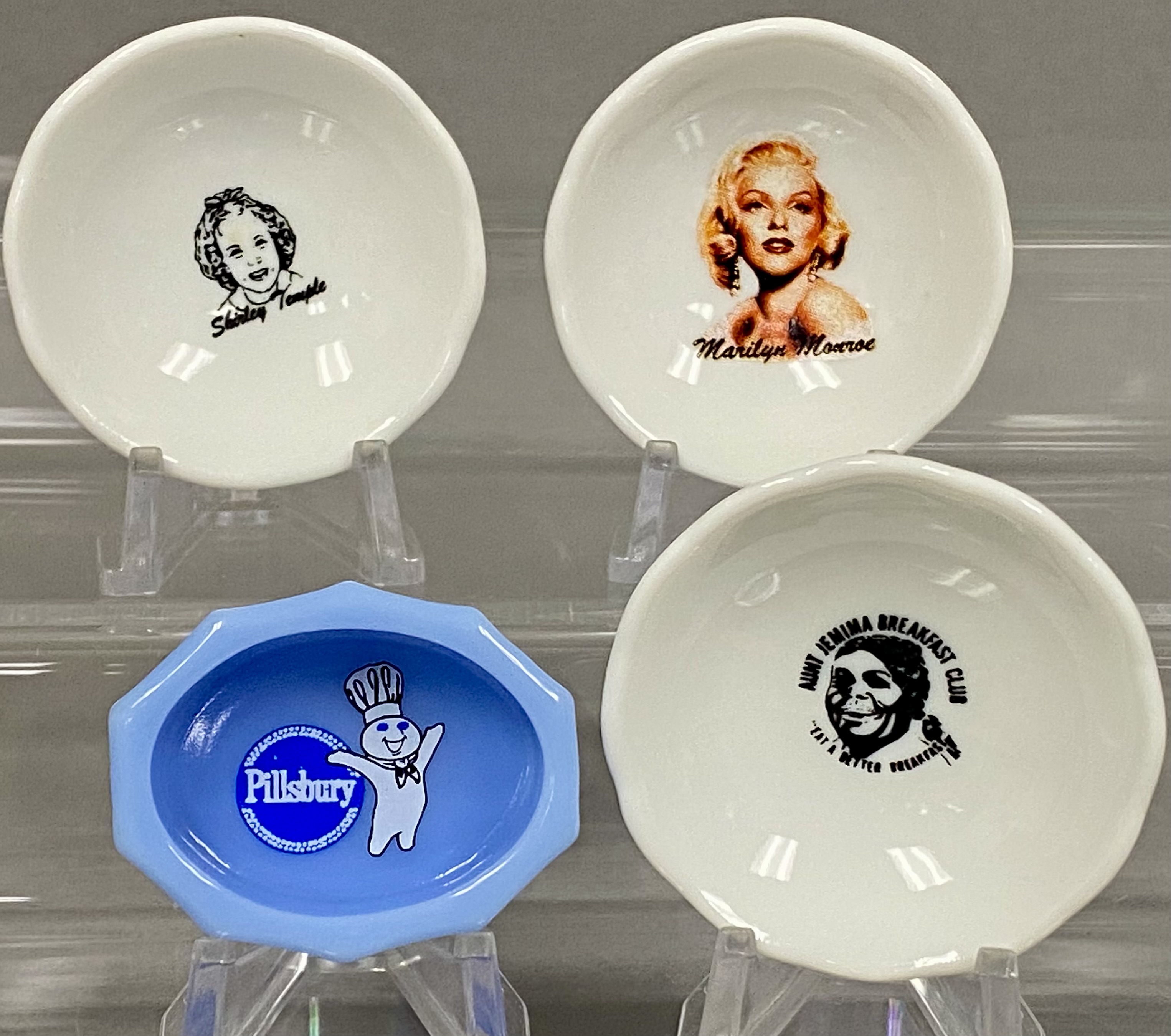Collection of Four Miniature Advertising Dishes