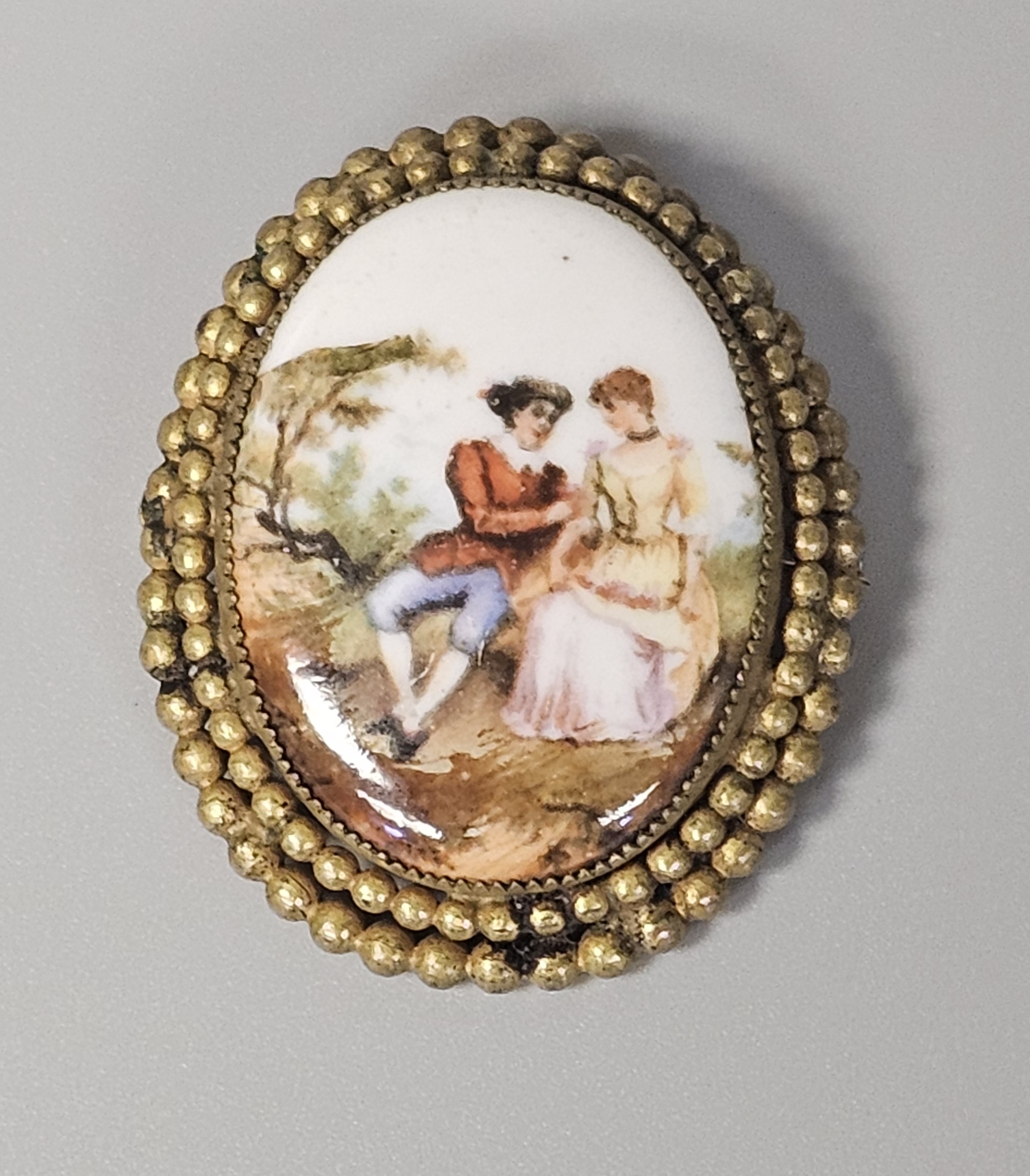 Hand-Painted Porcelain Courting Couple Brooch