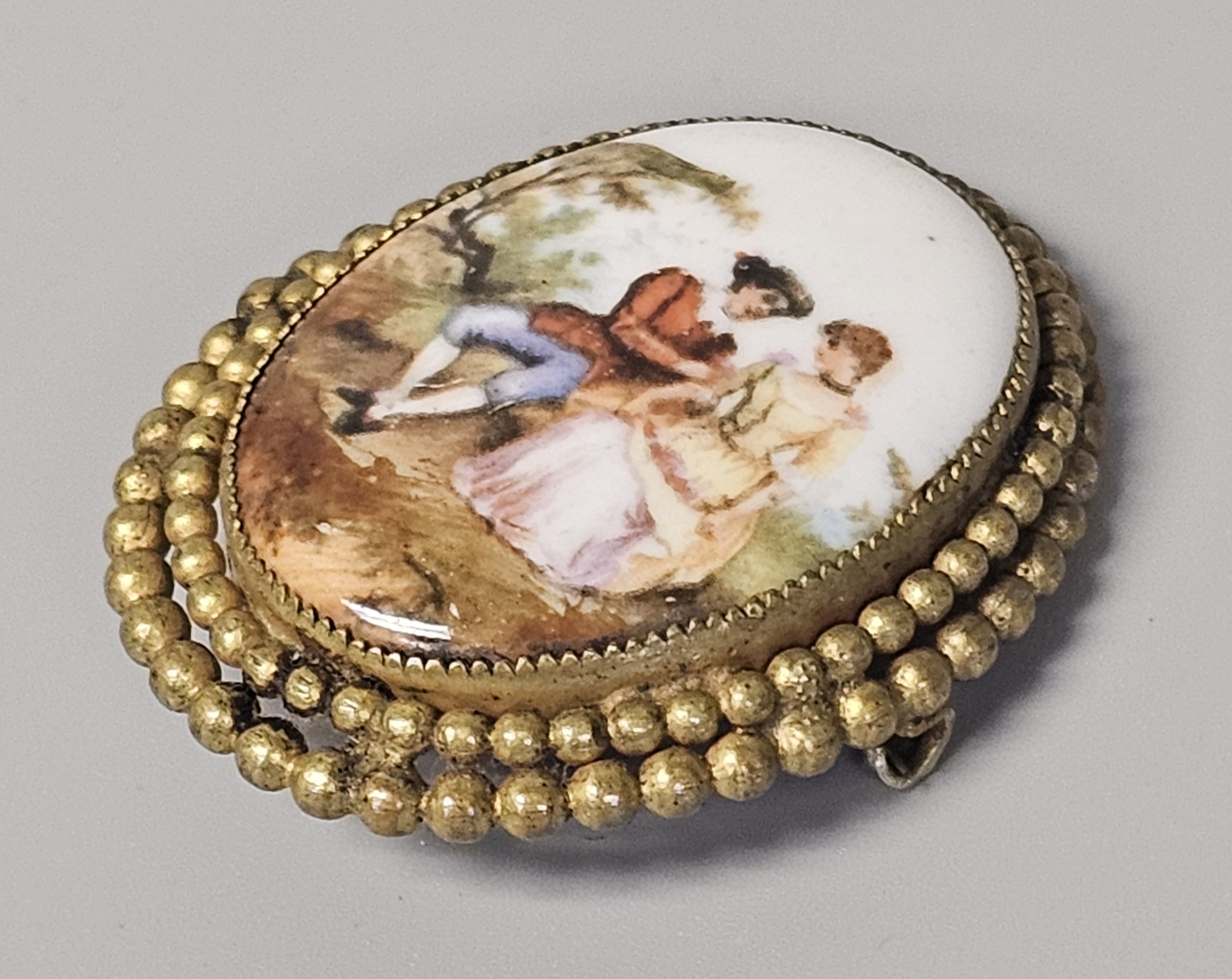 Hand-Painted Porcelain Courting Couple Brooch