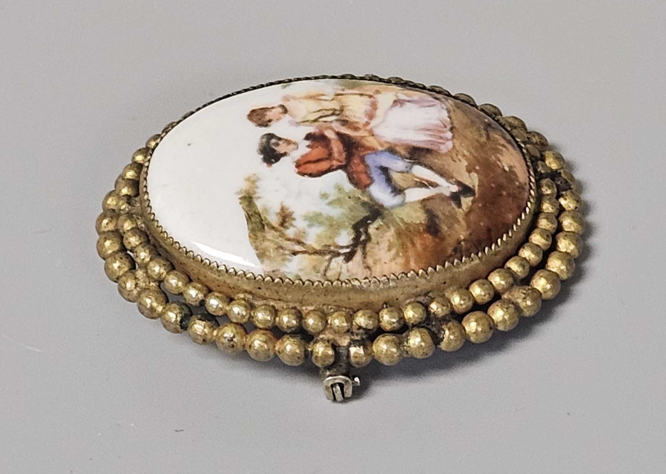 Hand-Painted Porcelain Courting Couple Brooch