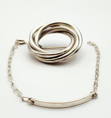 Sterling Pin & Bracelet 11.2 Grams. This lot features a James sterling silver brooch with 