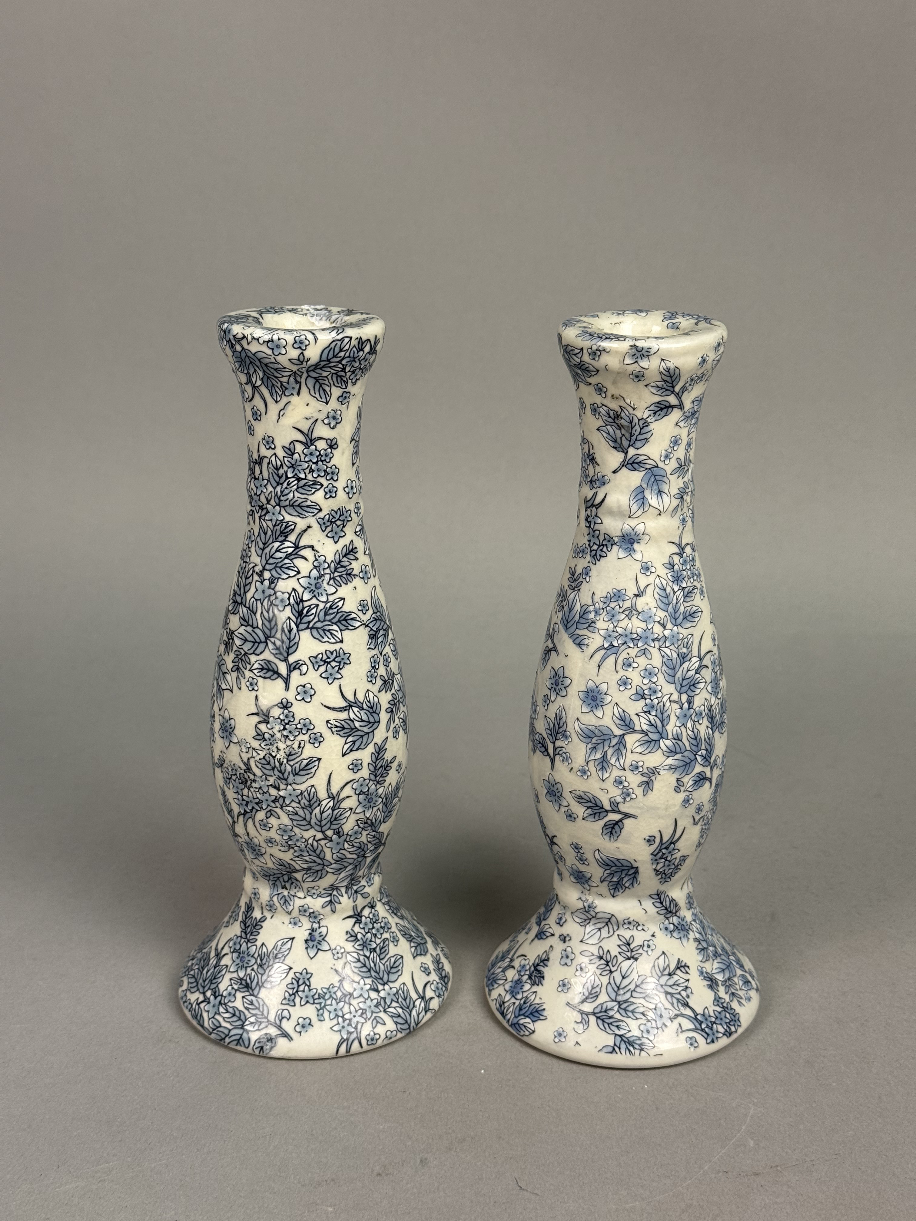 Pair of Orchid Brand Candlesticks
