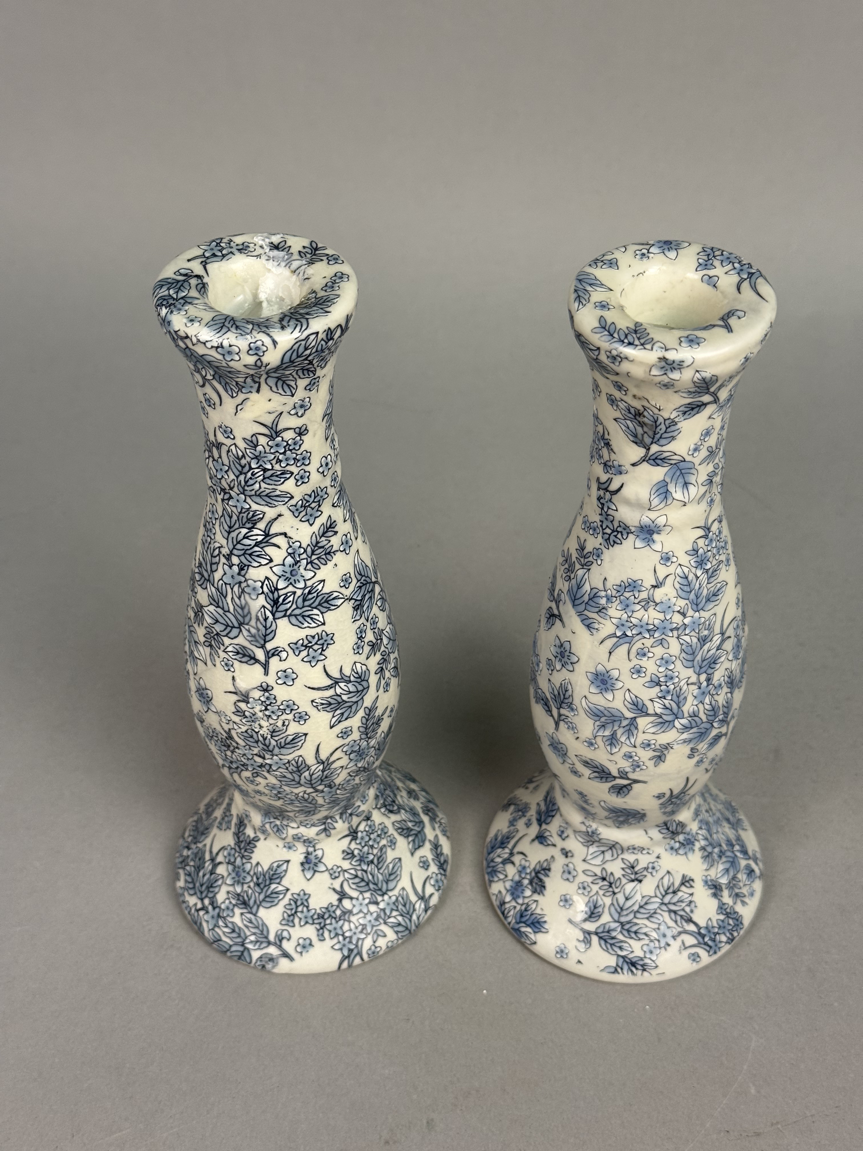 Pair of Orchid Brand Candlesticks