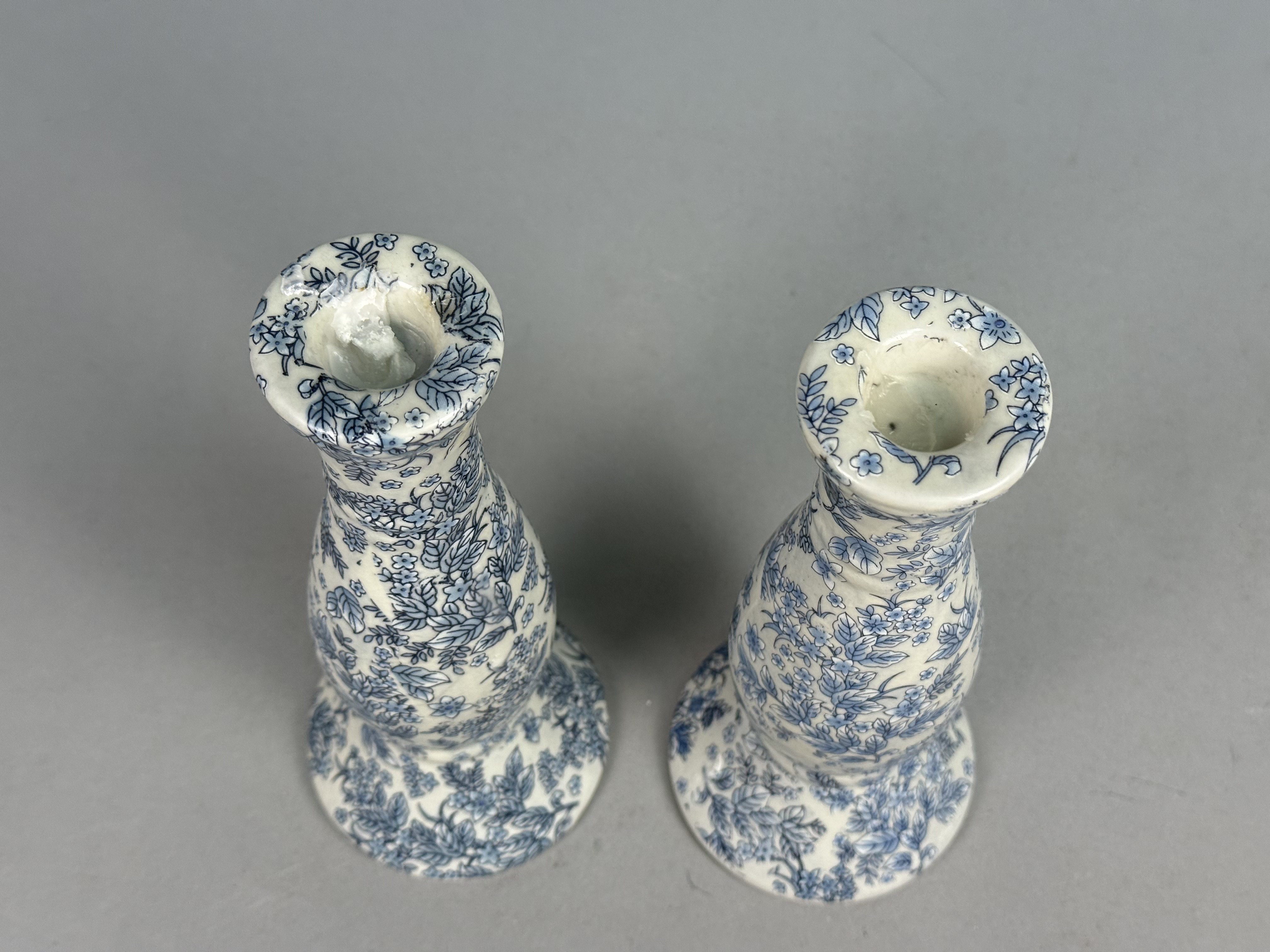 Pair of Orchid Brand Candlesticks