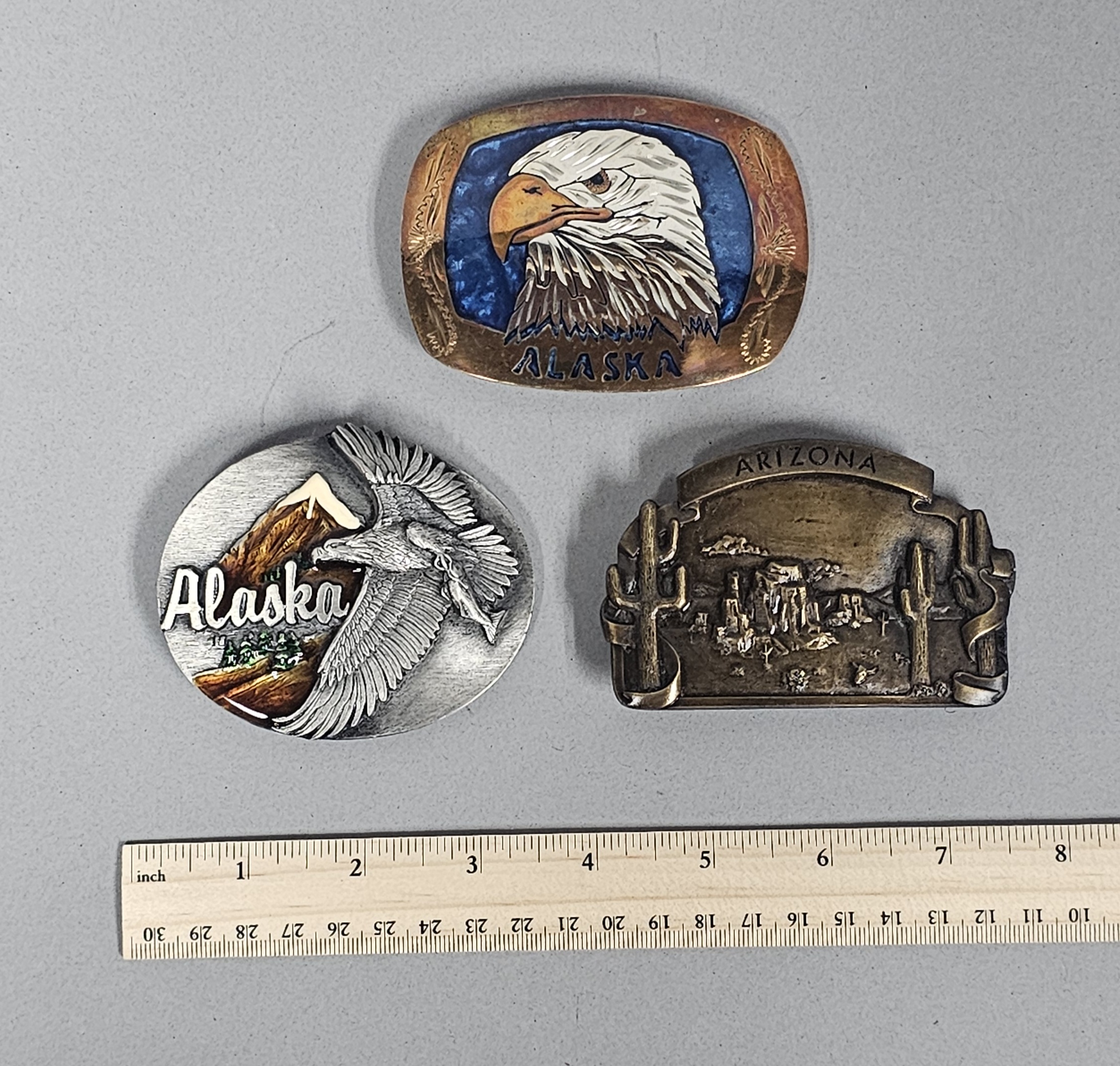 Trio of Souvenir Belt Buckles