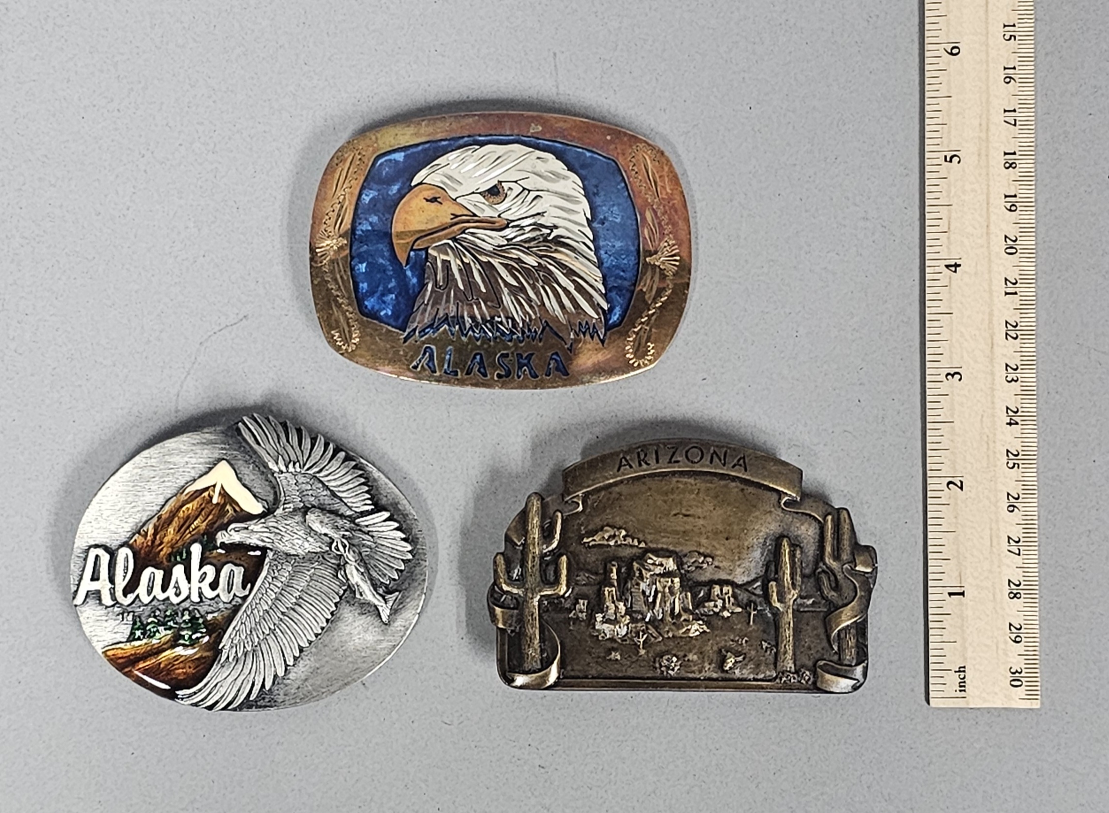 Trio of Souvenir Belt Buckles