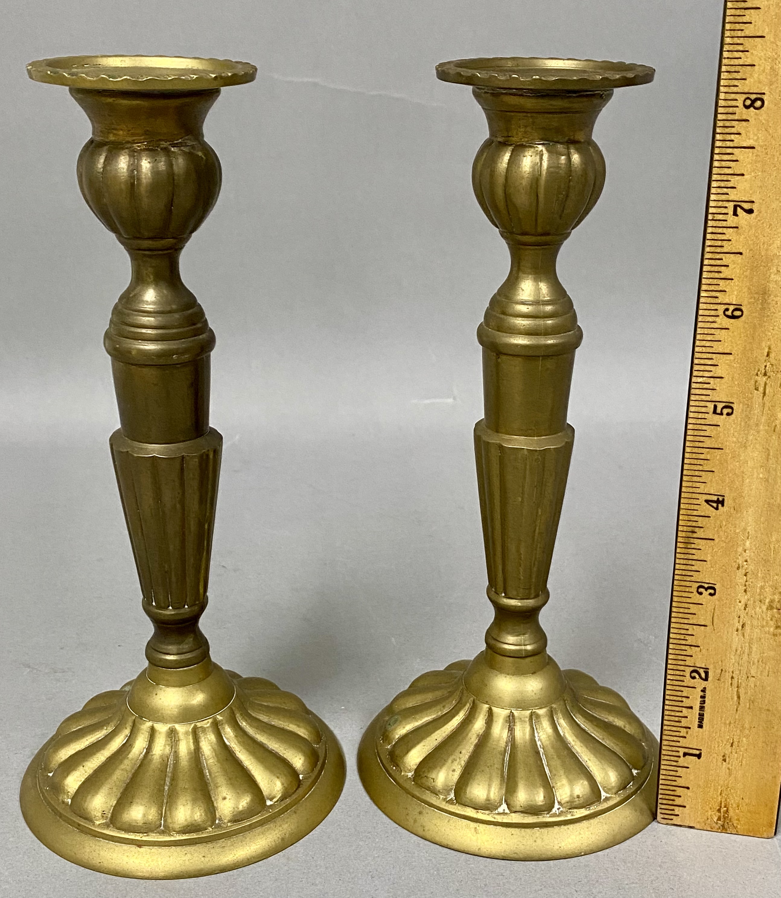 A Pair of Brass Candlesticks