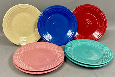7 Fiesta Mixed Color Ceramic Dinner Plates. A set of seven circular ceramic earthenware dinner 