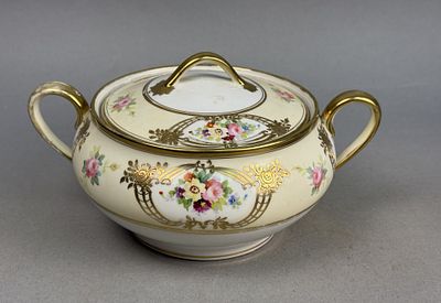 Nippon Porcelain Floral Lidded Sugar Bowl. A Japanese porcelain lidded sugar bowl featuring twin 