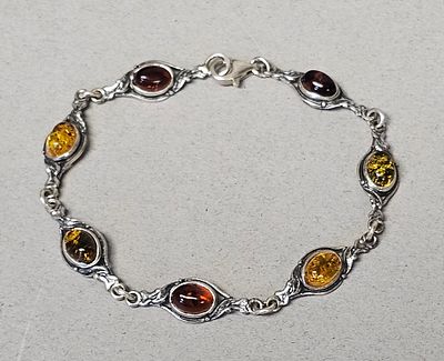 Sterling Multi-Colored Amber Link Bracelet 5.9 Grams. This sterling link bracelet features 