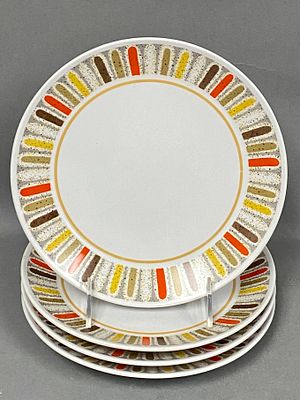 Noritake Progression Mardi Gras China Plates. A set of four circular ceramic salad or dessert 